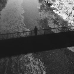 High angle view of people standing on footpath