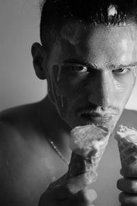 Close-up portrait of young man looking away