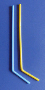 Close-up of colored pencils against blue background