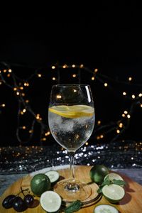 Close-up of drink on table against black background