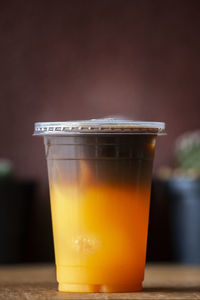 Close-up of coffee in glass on table