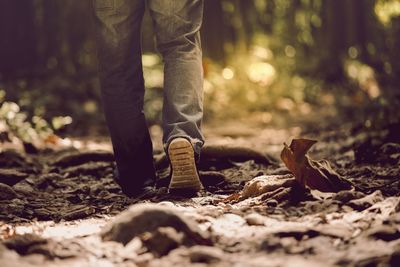 Low section of man standing on ground