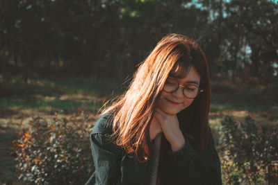 Portrait of young woman in forest