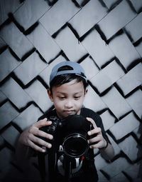 Portrait of boy photographing