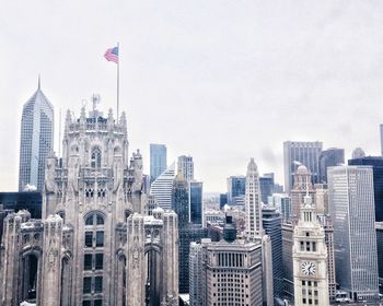 Skyscrapers in city against clear sky