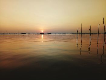 Scenic view of lake against sky during sunset