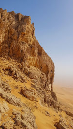 Rock formations in desert against clear sky