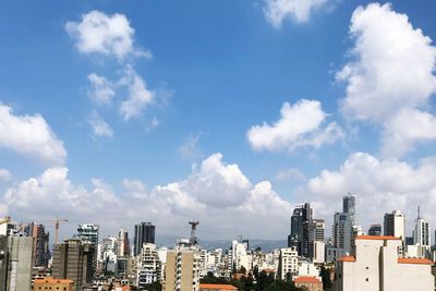 Buildings in city against sky