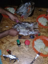 High angle view of person preparing food on table