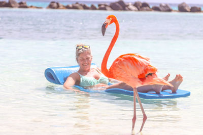 Side view of woman swimming in lake