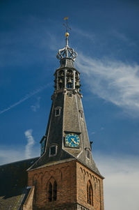 Low angle view of tower of building against sky