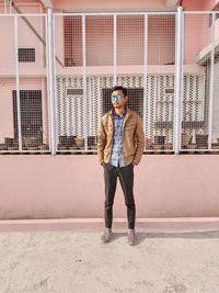 Full length rear view of man walking on street