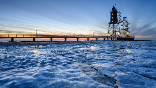 Pier over sea against sky during sunset - obereversand 