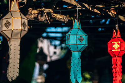 Low angle view of illuminated lanterns hanging at market stall