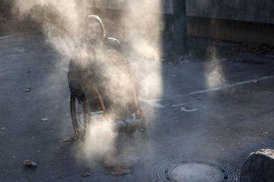 Portrait of smiling man sitting in wheelchair