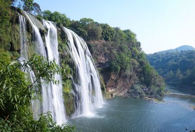Scenic view of waterfall in forest