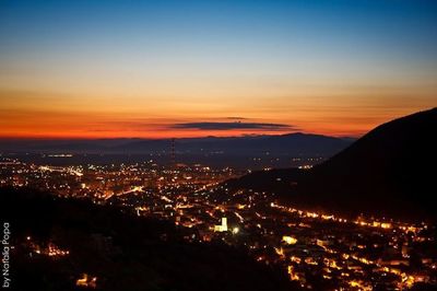 Aerial view of cityscape at night