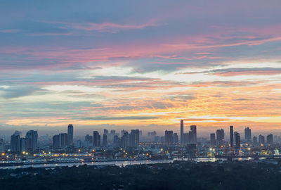 Cityscape against sky during sunset