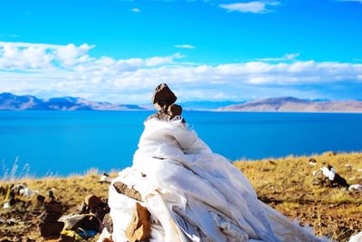 Scenic view of mountains against blue sky