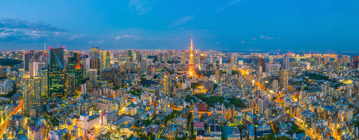 Aerial view of city lit up at night