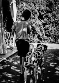 Full length of woman standing by railing