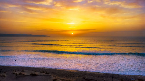 Scenic view of sea against sky during sunset