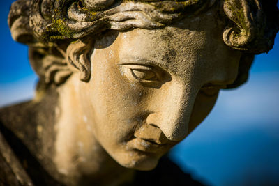 Close-up of ancient angel statue face. faith concept. religion icon.