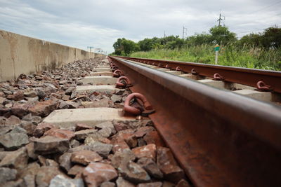 Train on railroad track against sky