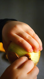 Close-up of woman holding apple