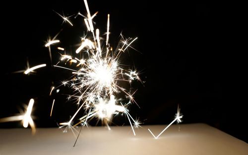 Firework display over black background