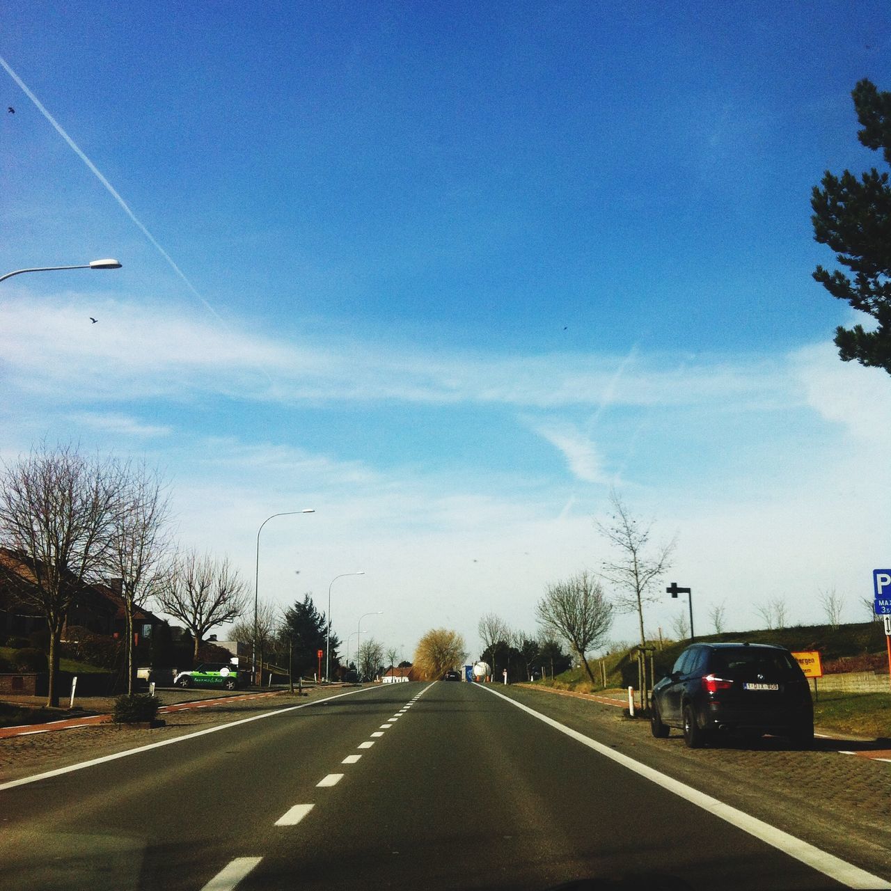 transportation, road, the way forward, car, road marking, land vehicle, diminishing perspective, mode of transport, sky, vanishing point, street, on the move, tree, blue, cloud - sky, highway, asphalt, empty, cloud, outdoors