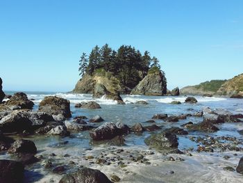 Scenic view of sea against clear blue sky