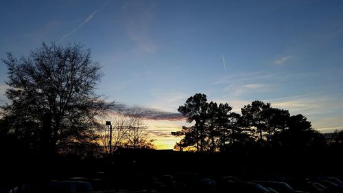 Silhouette of trees against sky at sunset