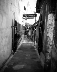 Alley amidst buildings in city