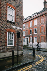 Houses by street in city