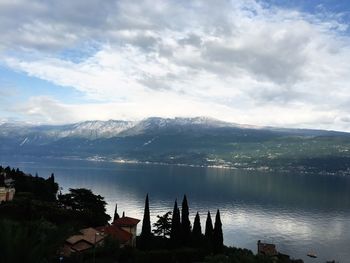 Scenic view of mountains against cloudy sky