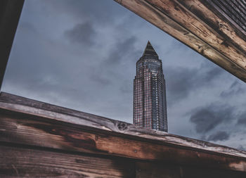 Low angle view of building against cloudy sky