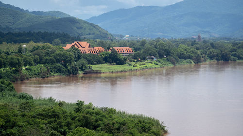 Scenic view of lake and mountains against sky