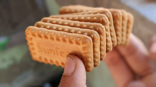 Close-up of hand holding bread