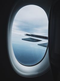 View of airplane wing seen through window