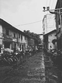 Street amidst buildings against sky