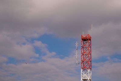 Low angle view of communications tower against sky