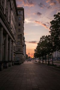 Buildings in city at sunset