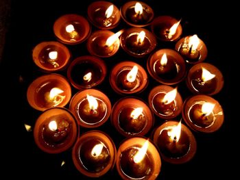Close-up of lit tea light candles