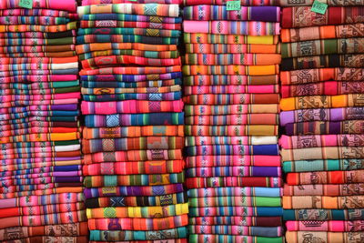 Full frame shot of folded colorful fabrics in store