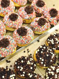 High angle view of donuts in tray on table