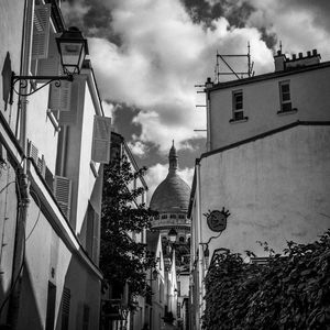 Low angle view of buildings against sky in city