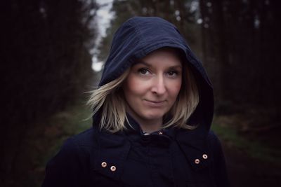 Close-up portrait of woman wearing hood jacket