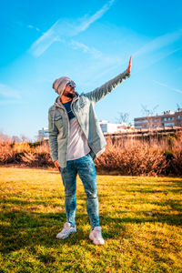 Full length of man standing on field