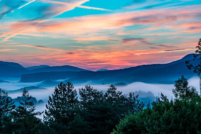 Scenic view of mountains against sky during sunset